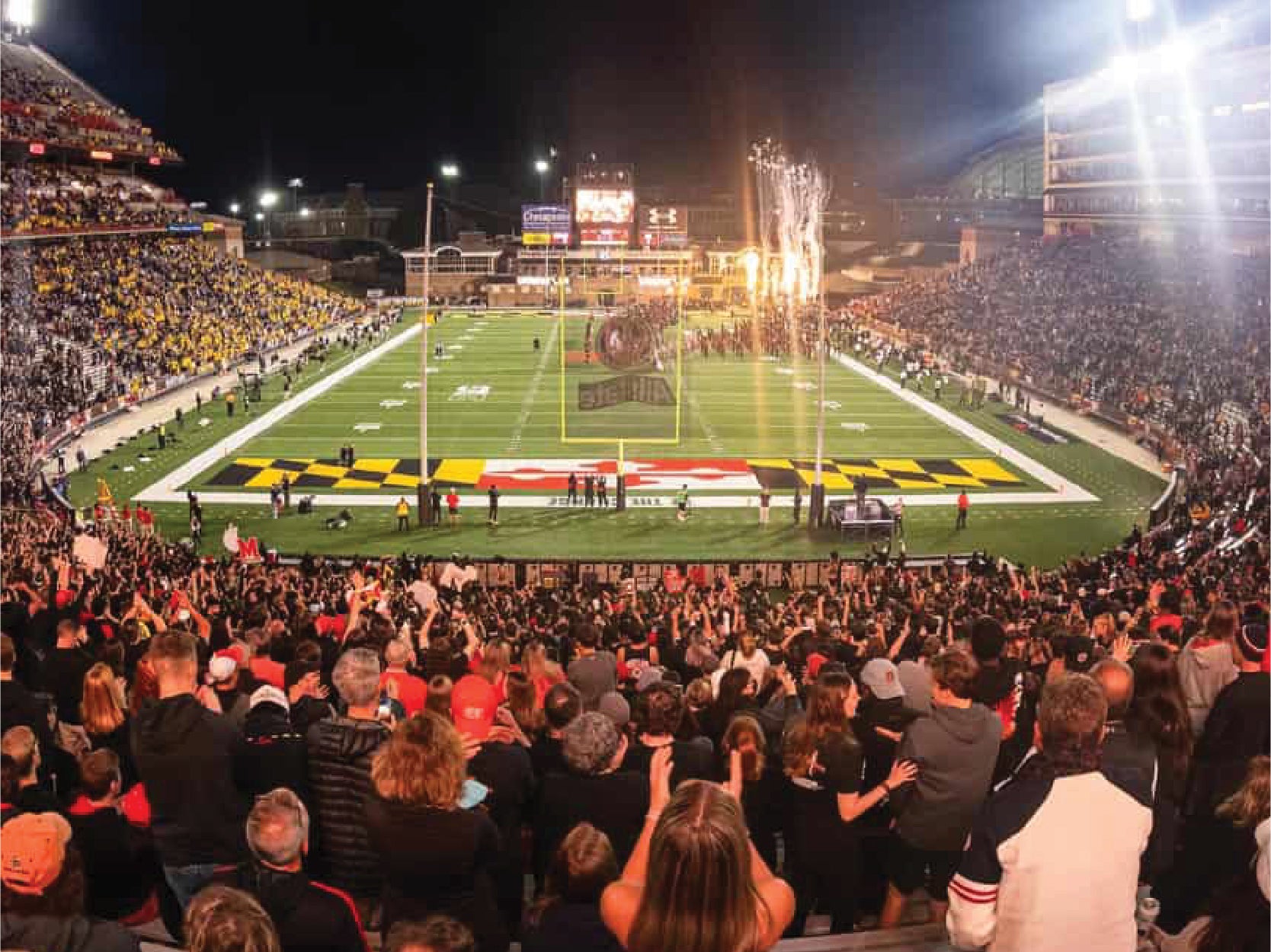 Fans cheer in a crowded Maryland stadium.