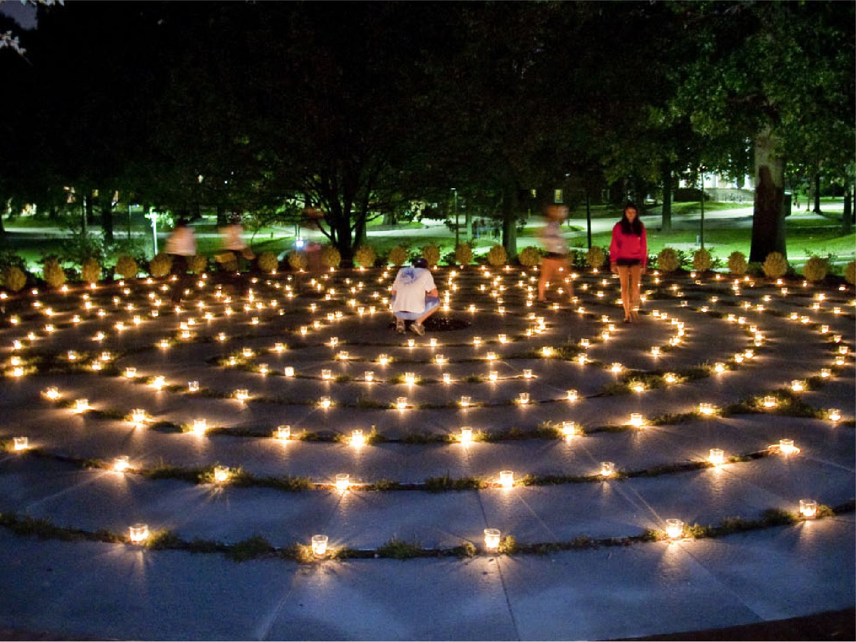 A photo of students taking a late night walk in the Garden Chapel.